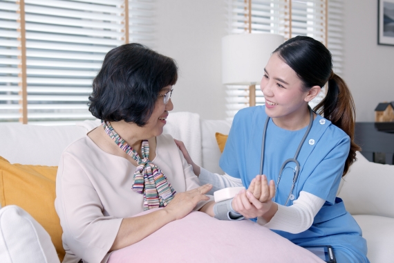 Scrub,Nurse,Doctor,Using,Digital,Tonometer,Check,Blood,Pressure,For