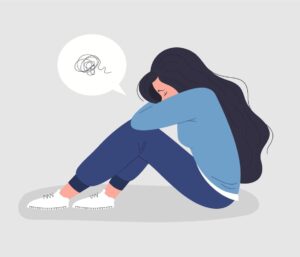 depressed-woman-sitting-with-her-head-down-free-vector